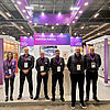 Messestand mit Messepersonal (Gruppenbild)