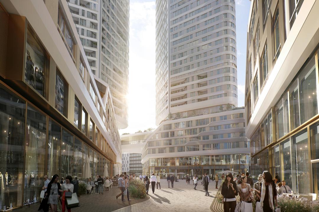 Blick auf das neue Hochhausquartier von einer belebten Straße aus.