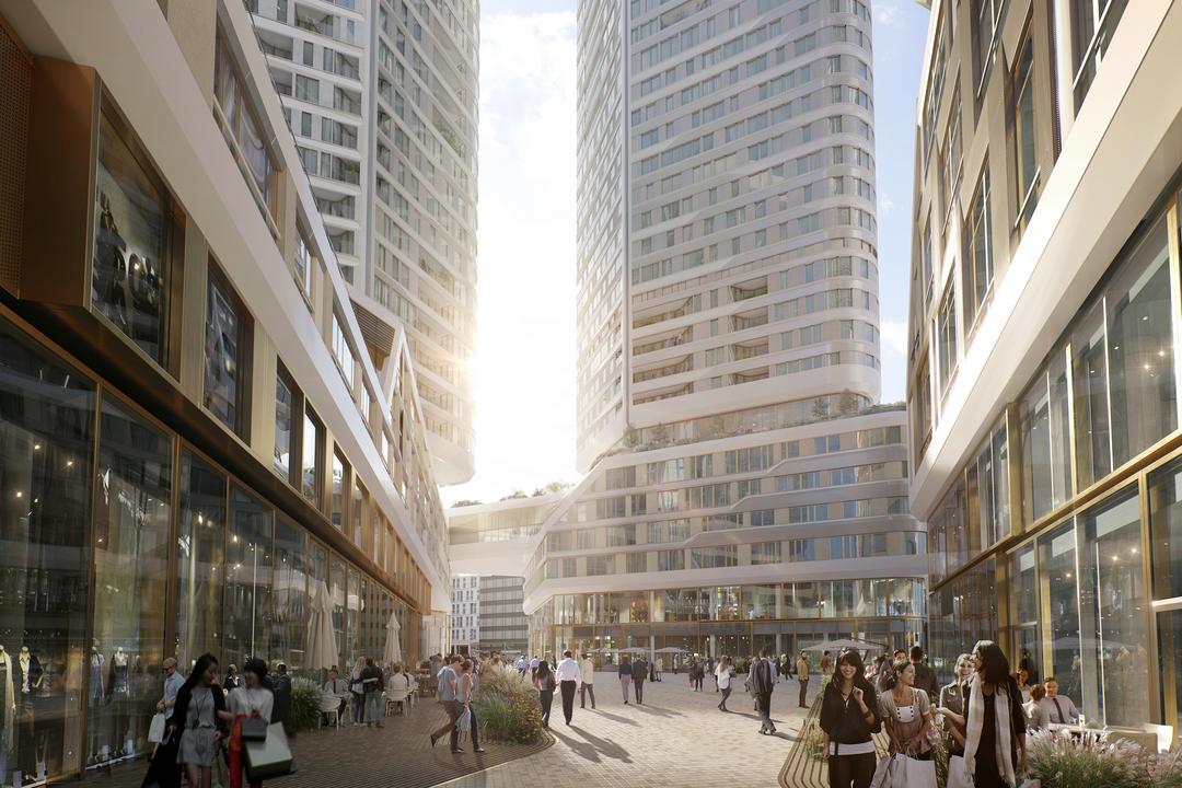 Blick auf das neue Hochhausquartier von einer belebten Straße aus.
